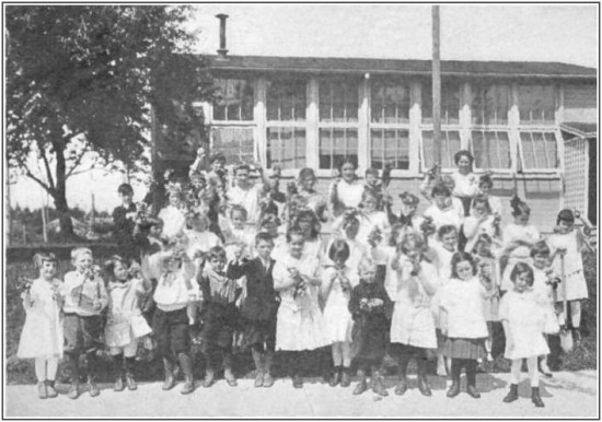 "First crop of radishes and lettuce at the Alameda Park School, Portland, Oregon, June, 1916. Even in the primary grades children may learn much about the science of growing things. Courtesy L.A. Alderman"