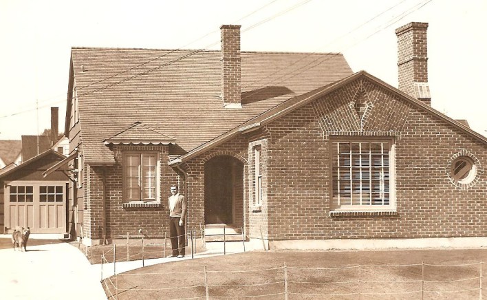 ken-in-front-of-house1 Designer and builder Kenny Birkemeier in front of a recently completed home at xxxx NE xx. Note the decorative brick pattern, and the oculus window...details that he used in other homes. Photo courtesy of Dan Birkemeier.